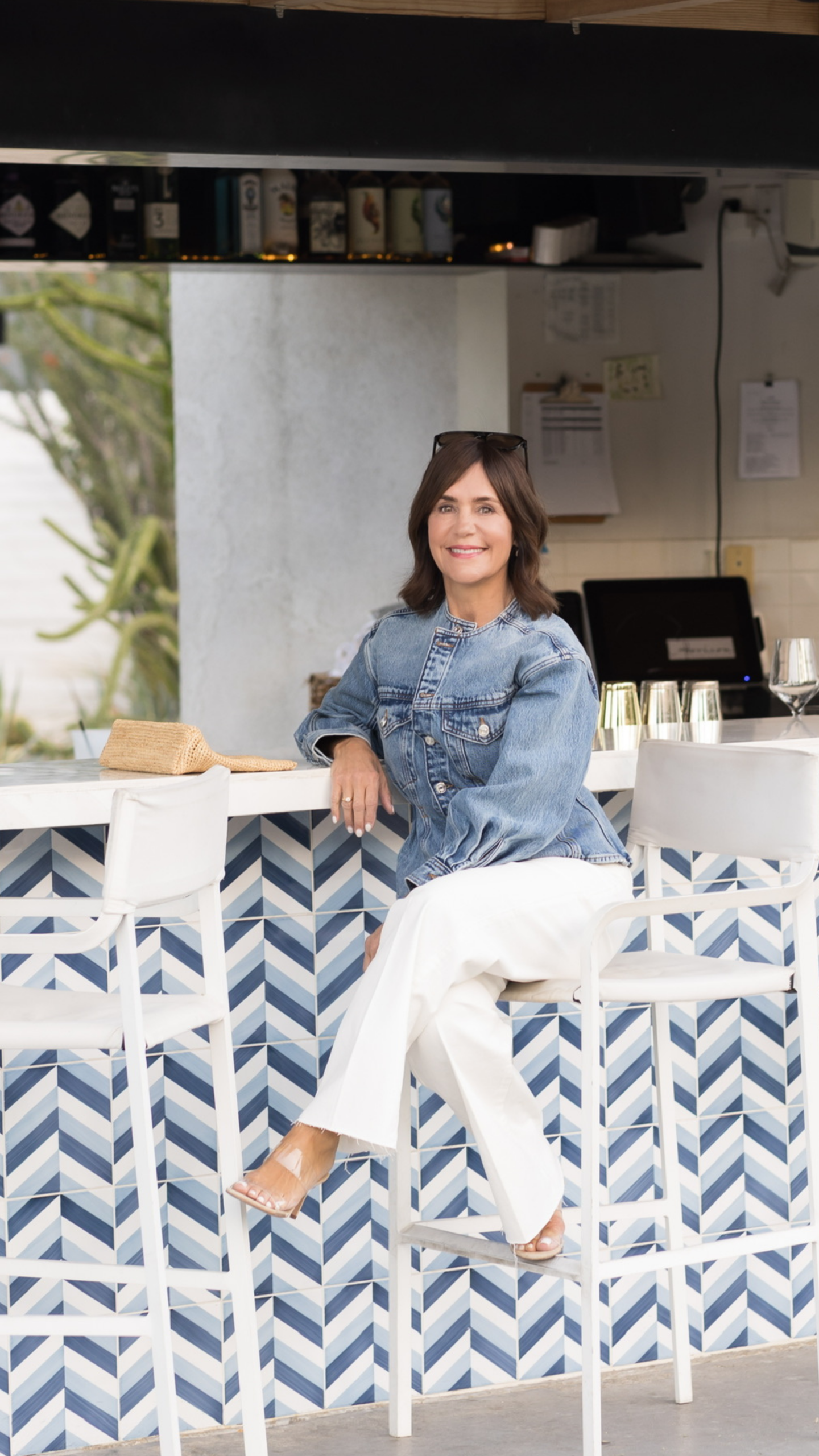 So Susie in denim jacket, white jeans in Palm Springs